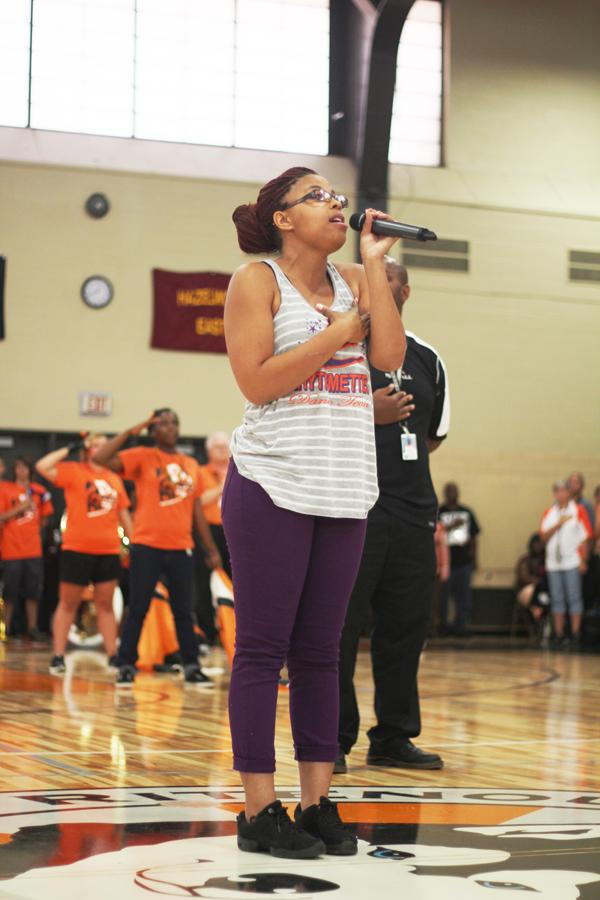 Senior Tiffany Butler sings the National Anthem using the new sound system during the 2013 Howdy Assembly 