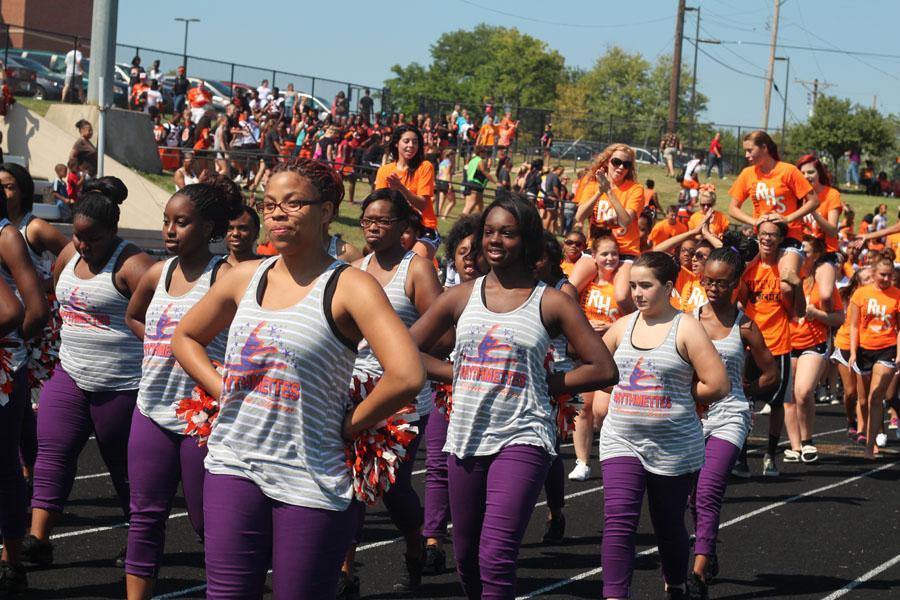 The rytmettes march in formation around the track