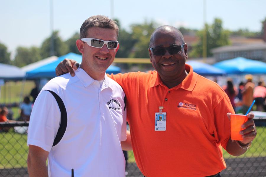 Athletic+Director+Drew+Lohnes+stands+with+Wyland+Principal+Kent+Adams+at+the+Black+and+Orange+Day+festivities+in+August%2C+his+first+Black+and+Orange+Day+as+Ritenour+Athletic+Director.+