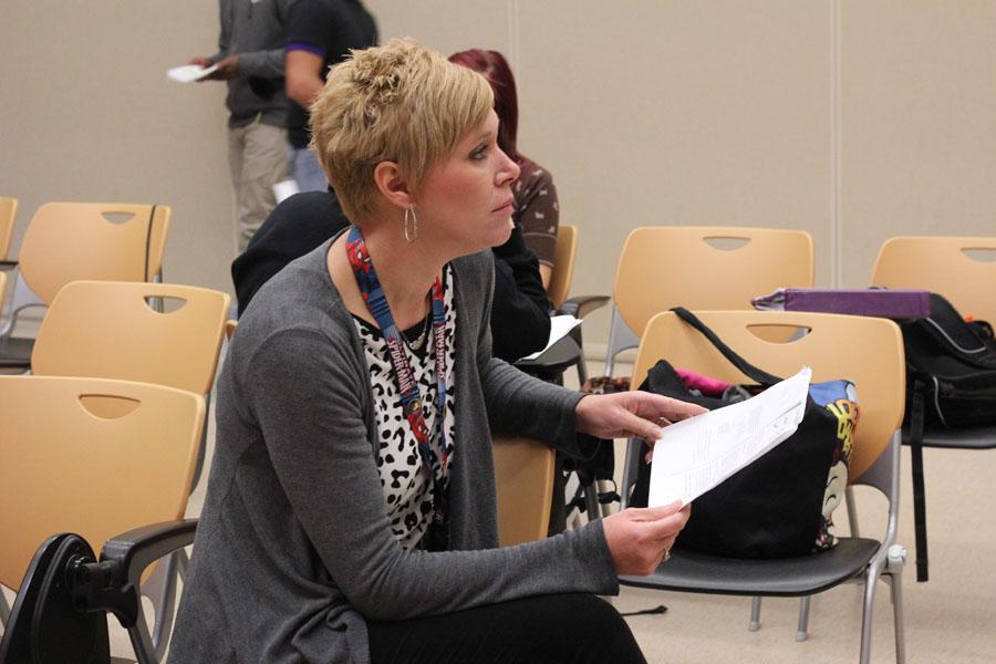 Drama teacher Patricia Ulrich watches the rehersal of a student play during her drama class.