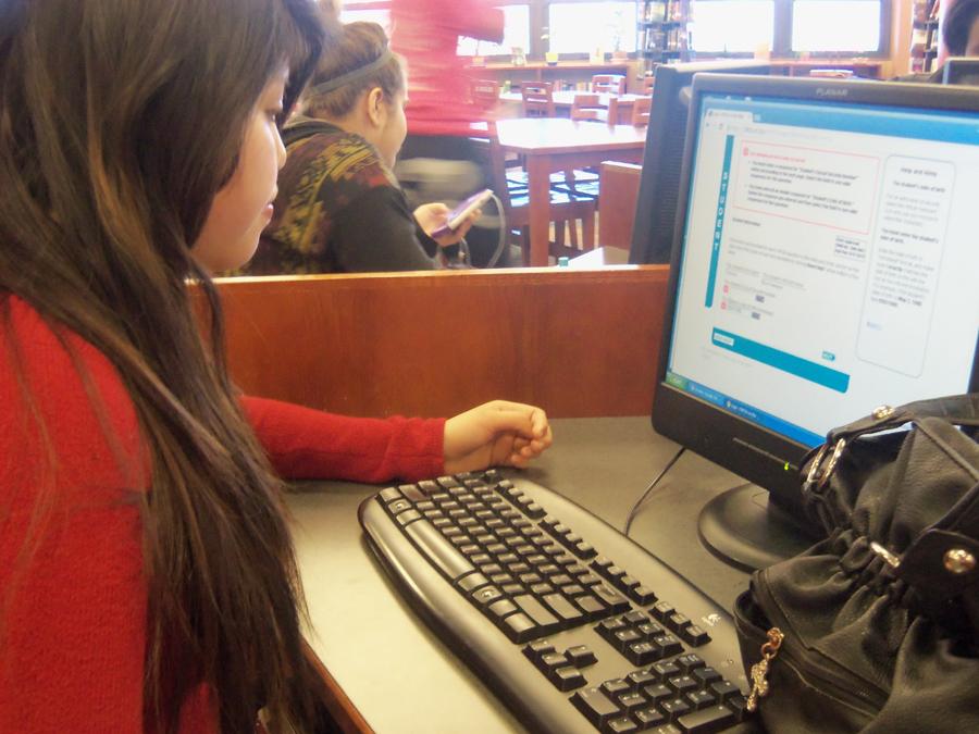 Senior Yazmin Ruiz works to finish her FAFSA in the Ritenour High School Media Center. 