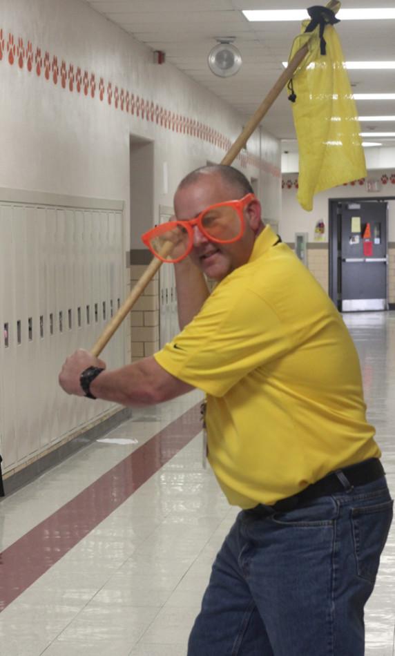 Spanish teacher Dean Cochran shows off his ghost hunting equipment in the Ritenour hallway. 