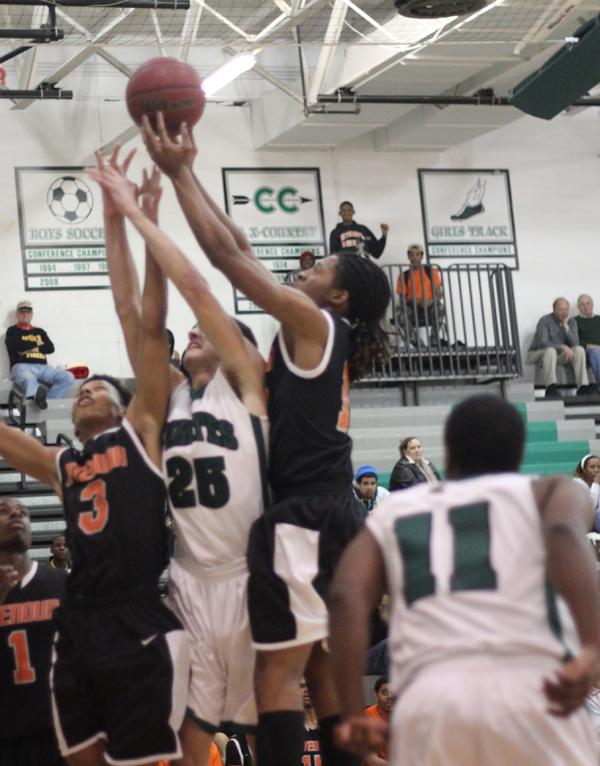 Senior+Travon+Thomas+is+in+triple+threat+position+during+a+game+at+Pattonville%2C+trying+to+decide+whether+to+dribble%2C+pass%2C+or+shoot.+