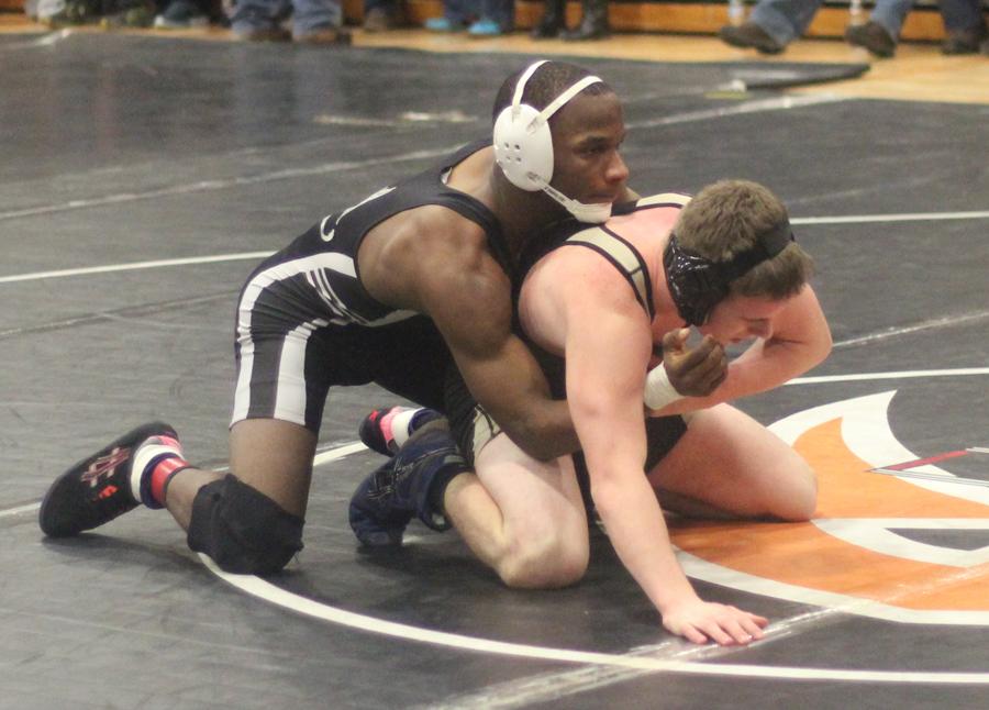 enior Tyron Welch puts his opponent in a hold at the District wrestling tournament. 
