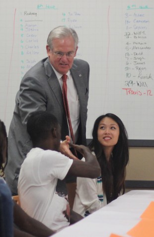 Governor Jay Nixon shakes senior DaQuwain Dunn's hand during the round table discussion  