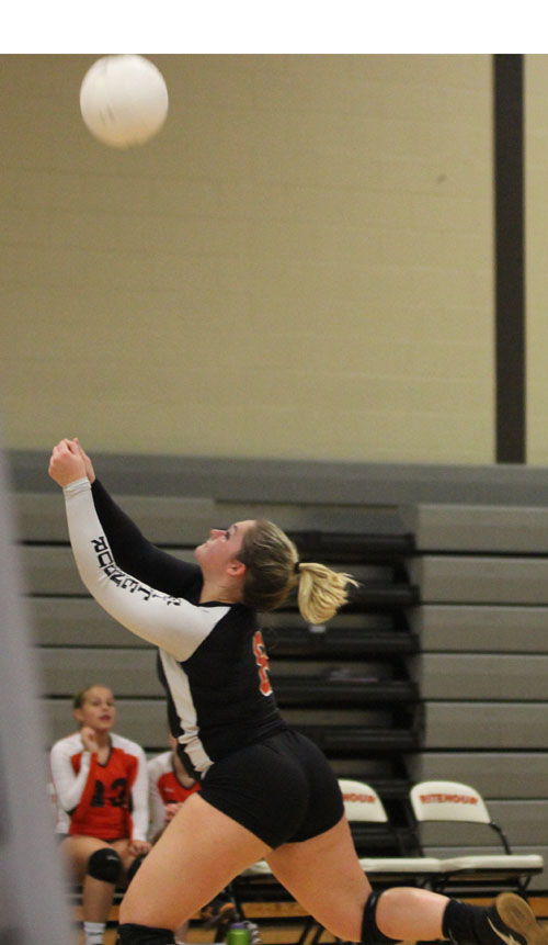 Senior Jessica Poelker prepares to hit the ball during the game against Clayton 