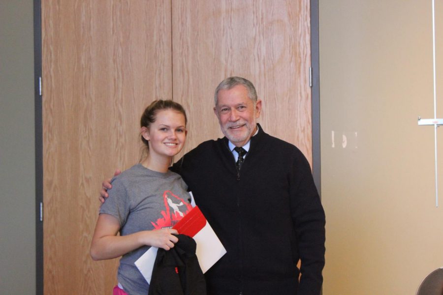 Dr. Carlos Vargas-Aburto, president of SEMO, poses with senior Cassidy Schatz.  Dr. Vargas presented Schatz with an admission letter to SEMO when he spoke to students on Dec. 1.