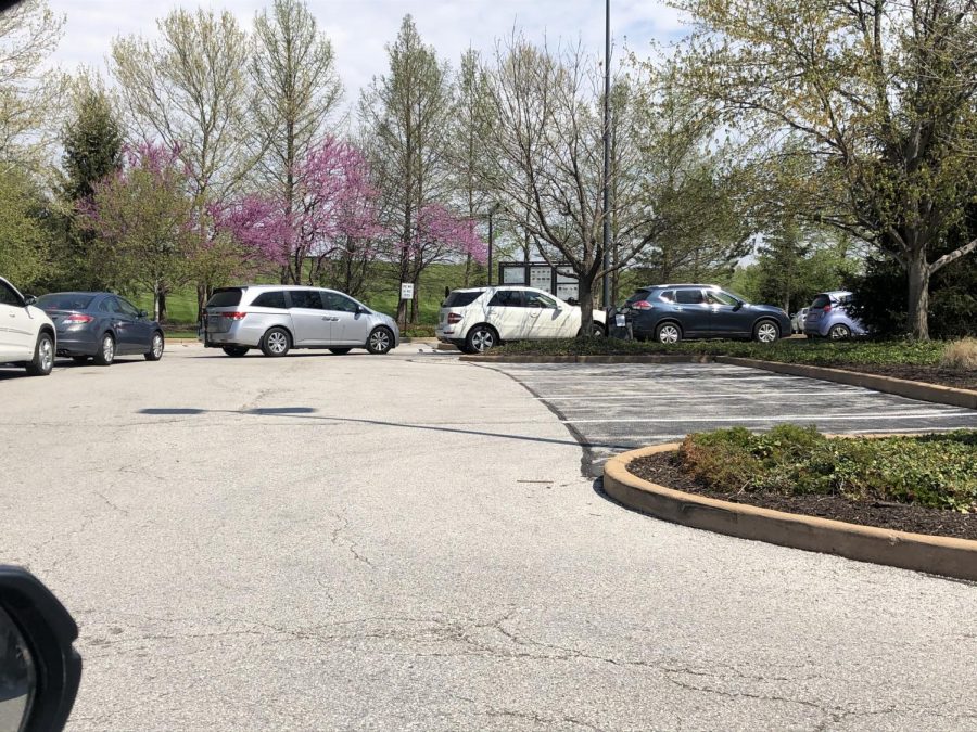Cars lind up at the Starbucks drive thru in Manchester.  The stay home order has not stopped people from trying to find senses of normalcy at places like Starbucks. 
