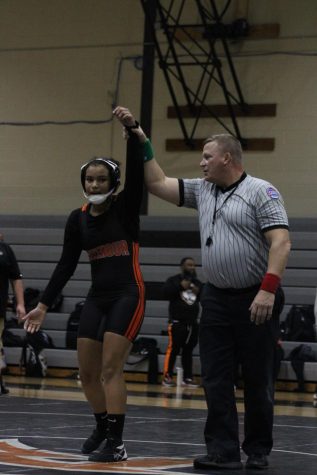 Freshman Julian Smith is declared a winner in her meet against Brentwood High School. 