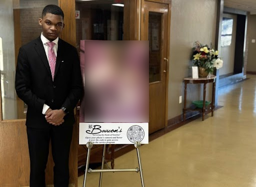 Senior Terrence Clark presides over a funeral at Baucoms Life Celebration Center.  Clark is a funeral attendant, and plans on earning his degree so that he can become a mortician. (Photo edited for privacy of family at funeral)