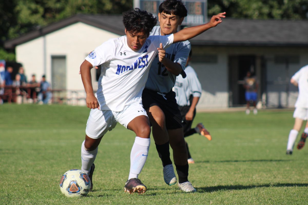 Diego Bolanos attempts to steal the ball from his Northwest opponent.