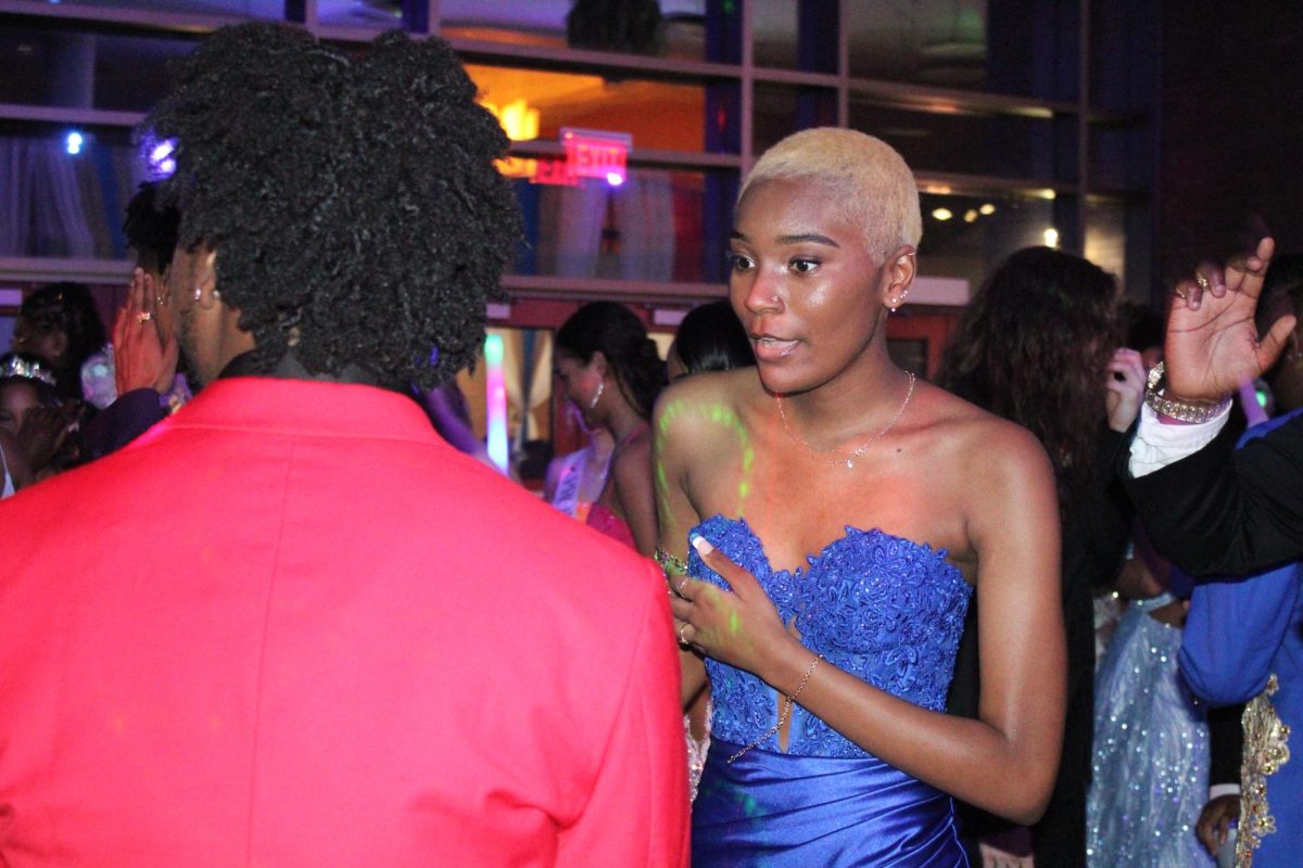 Senior Teri Easby dances with the other prom-goers. Easby was excited to go to prom, since she got to see many of her friends for the first time since graduating early. 
