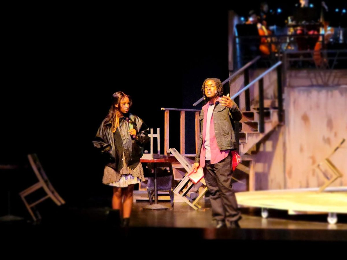 Junior Haiyah Keen (Eurydice) meets senior EJ Davis (Orpheus) in the play, "Hadestown." This is the first meeting of the two main characters who will eventually fall in love. 