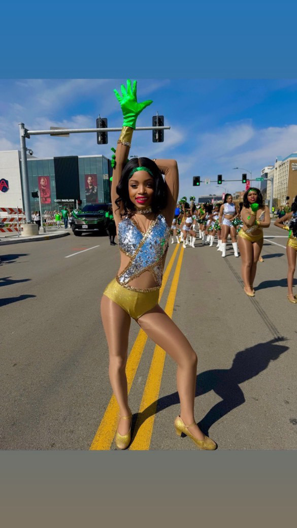 Sophomore Lailah Betton performs with her dance troupe at the St. Patrick's Day Parade in downtown St. Louis.
