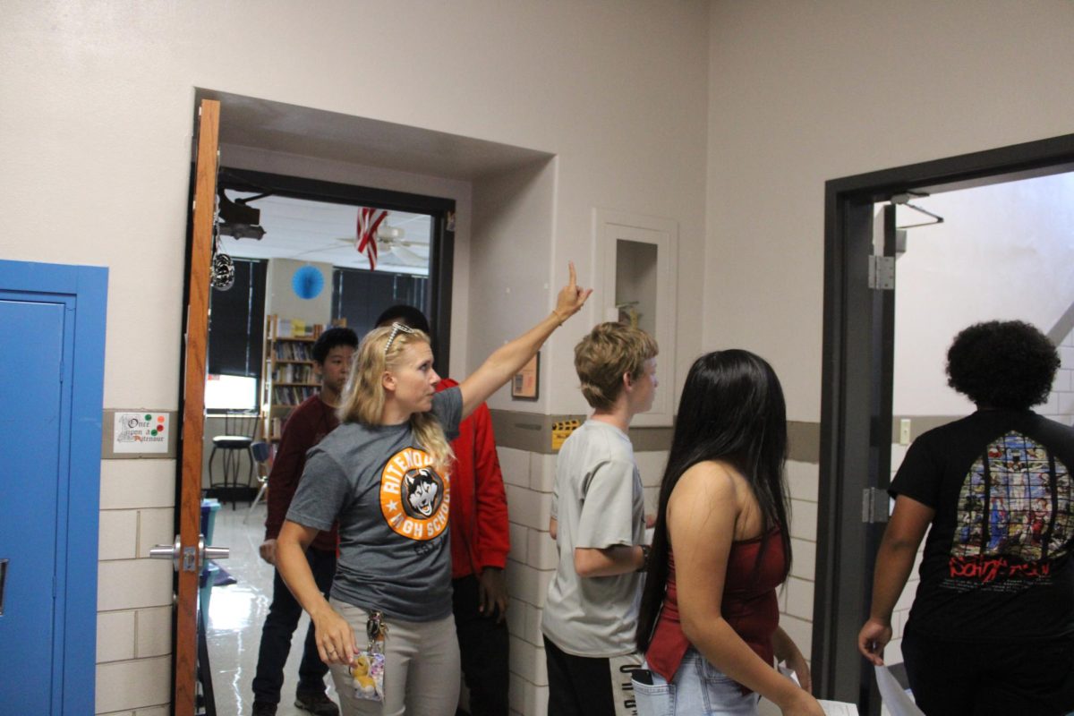 English teacher Meredith Alton directs the freshmen from her class as they head to their next block. 