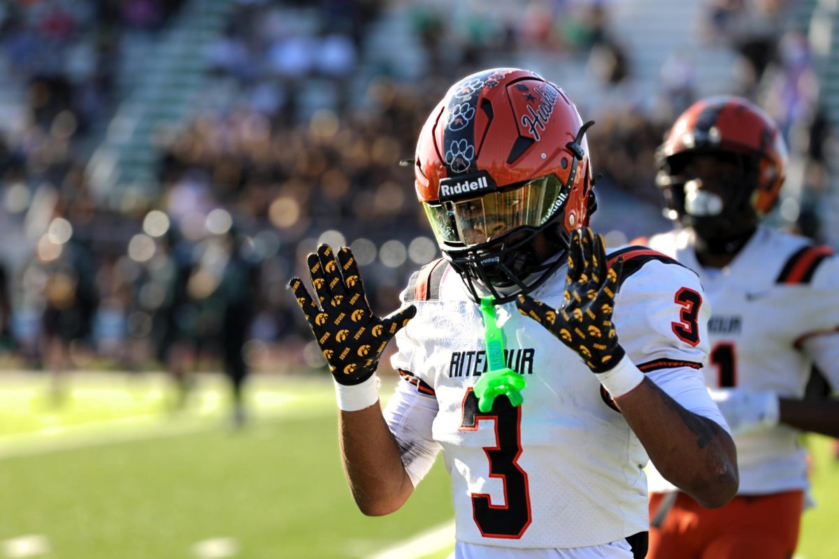 Senior Troy Jackson waves to the crowd at the start of the district matchup against Pattonville on November 15. 